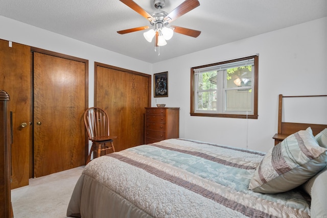 15 Tarifa Ln, Hot Springs Village, AR 71909 - bedroom featuring a ceiling fan, multiple closets, and light carpet