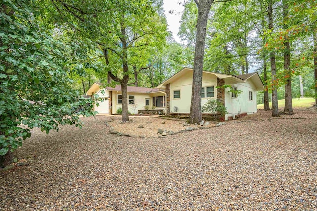 15 Tarifa Ln, Hot Springs Village, AR 71909 - rear view of house with driveway and a garage