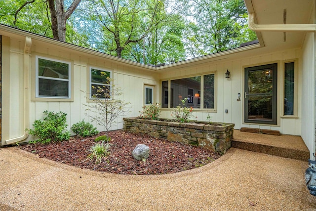 15 Tarifa Ln, Hot Springs Village, AR 71909 - view of exterior entry with board and batten siding