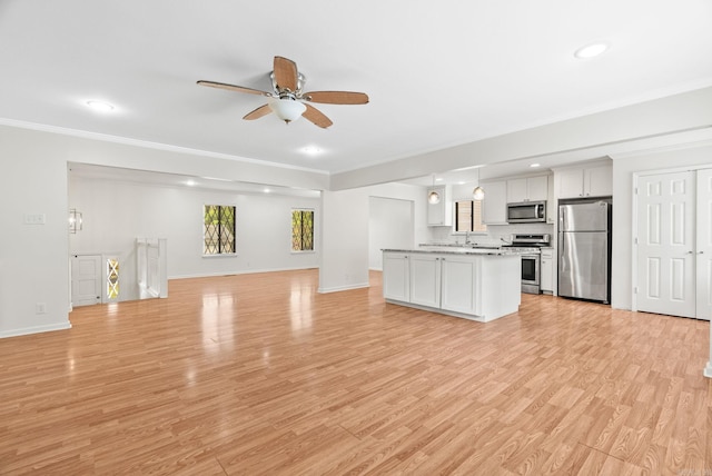 unfurnished living room with a ceiling fan, crown molding, baseboards, recessed lighting, and light wood-style flooring
