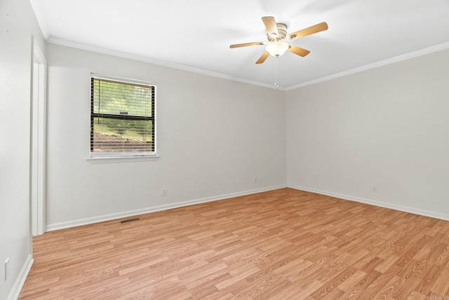 unfurnished room featuring light wood-style floors, baseboards, ornamental molding, and ceiling fan