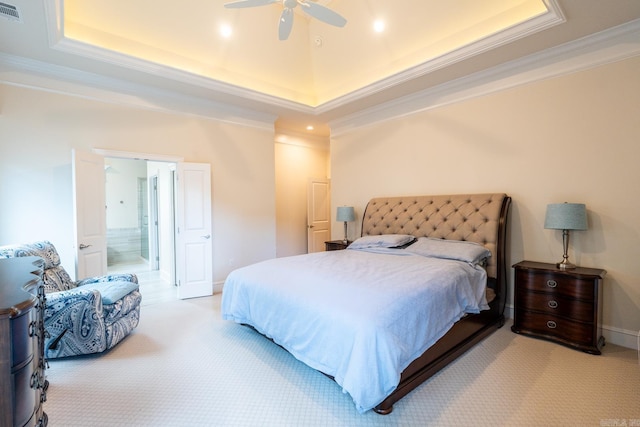 bedroom with a raised ceiling, ornamental molding, baseboards, and visible vents