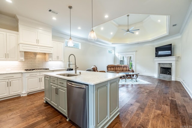 kitchen featuring stainless steel dishwasher, open floor plan, visible vents, and a sink
