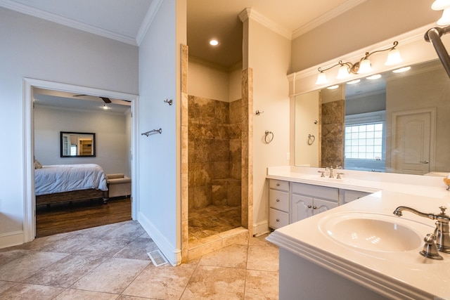bathroom with walk in shower, a sink, double vanity, baseboards, and ornamental molding