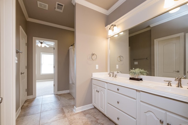 full bath featuring double vanity, a ceiling fan, visible vents, and a sink