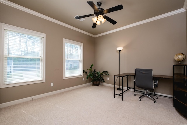 carpeted office featuring crown molding, baseboards, and a ceiling fan