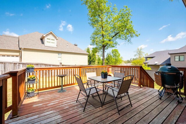 wooden deck featuring outdoor dining space