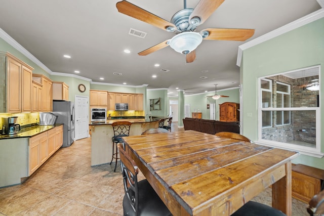 dining space featuring crown molding, visible vents, recessed lighting, a ceiling fan, and light tile patterned floors