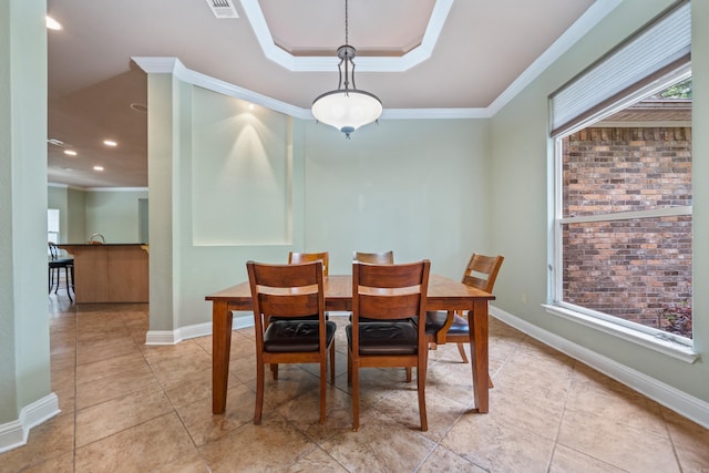 dining room with crown molding, baseboards, visible vents, and light tile patterned floors