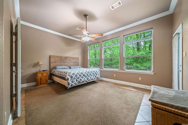 bedroom with baseboards, visible vents, ornamental molding, and light tile patterned floors