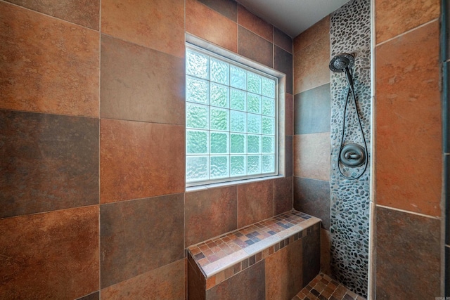 full bath with tiled shower