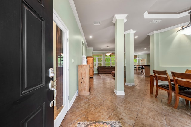 entrance foyer with crown molding, recessed lighting, baseboards, and visible vents