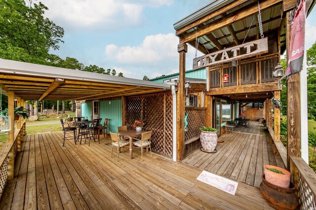 4 Long Hill Rd, Higden, AR 72067 - wooden terrace with outdoor dining area