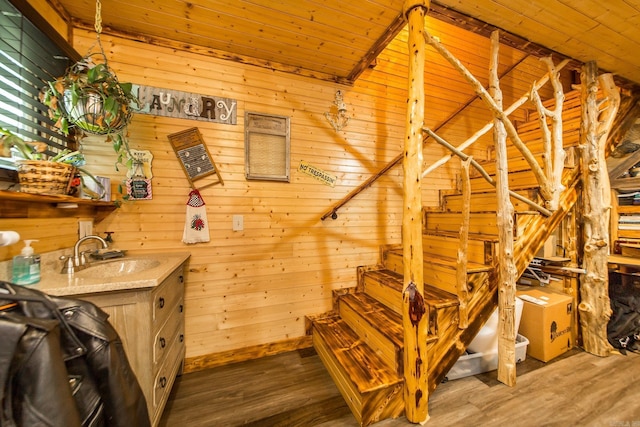 4 Long Hill Rd, Higden, AR 72067 - staircase featuring wood finished floors, wooden walls, and wooden ceiling