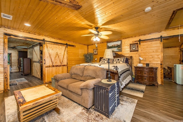 4 Long Hill Rd, Higden, AR 72067 - bedroom with wooden walls, a barn door, and wooden ceiling