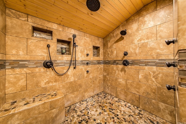 4 Long Hill Rd, Higden, AR 72067 - bathroom featuring stone finish floor, vaulted ceiling, a tile shower, and wood ceiling