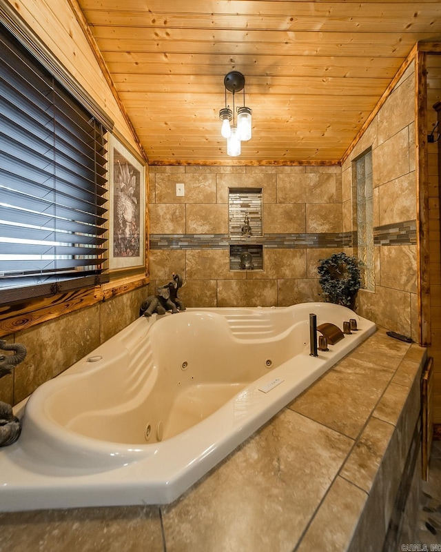 4 Long Hill Rd, Higden, AR 72067 - bathroom with a jetted tub, lofted ceiling, wooden ceiling, and tile walls