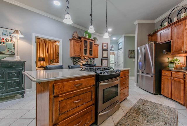 kitchen with brown cabinetry, crown molding, light tile patterned floors, glass insert cabinets, and stainless steel appliances