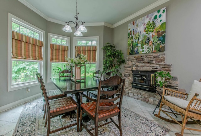 dining space featuring crown molding, light tile patterned floors, a notable chandelier, and a healthy amount of sunlight