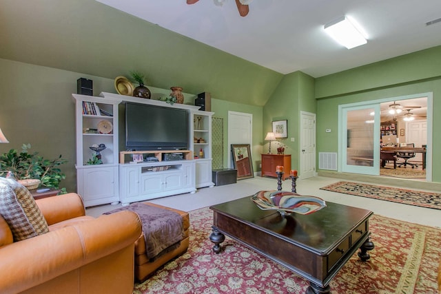 living area featuring visible vents, carpet flooring, and ceiling fan