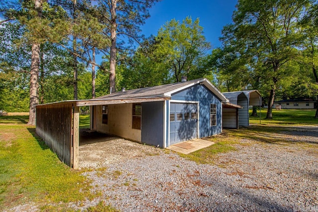 garage with a garage and driveway