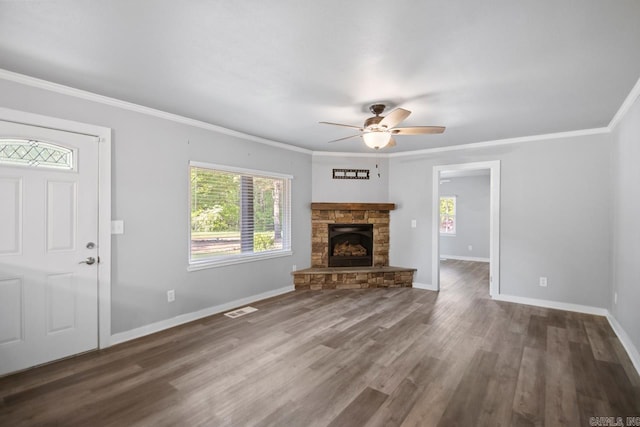 unfurnished living room featuring visible vents, baseboards, ceiling fan, and a wealth of natural light