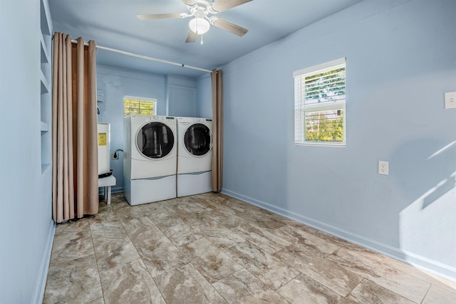 laundry area featuring baseboards, a ceiling fan, independent washer and dryer, and electric water heater