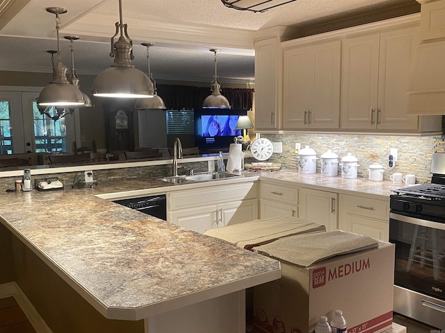 874 Stacy Spgs, Heber Springs, AR 72543 - kitchen with a sink, stainless steel gas stove, white cabinets, a peninsula, and hanging light fixtures