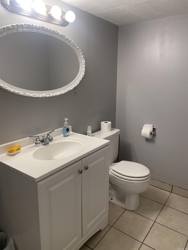 874 Stacy Spgs, Heber Springs, AR 72543 - bathroom featuring a textured ceiling, vanity, tile patterned flooring, and toilet