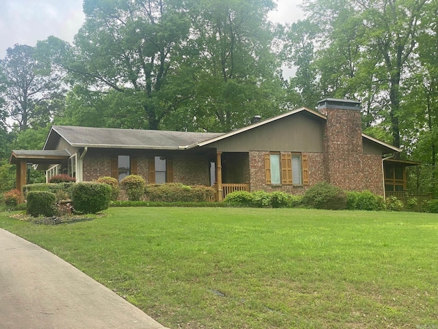 874 Stacy Spgs, Heber Springs, AR 72543 - view of front of home featuring a front yard, brick siding, a chimney, and a porch
