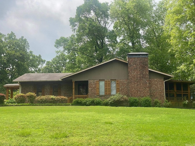 874 Stacy Spgs, Heber Springs, AR 72543 - view of front facade featuring a front yard, brick siding, and a chimney