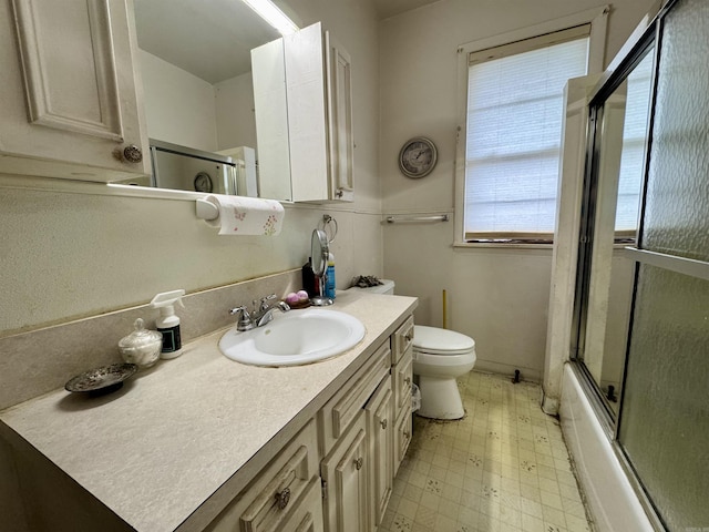 1519 S Oak St, Little Rock, AR 72204 - bathroom with toilet, tile patterned floors, enclosed tub / shower combo, and vanity