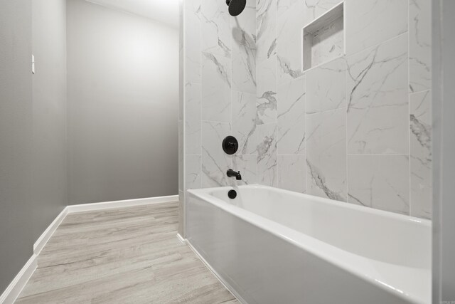 609 S St, Hot Springs, AR 71913 - bathroom featuring baseboards, wood finished floors, and bathtub / shower combination