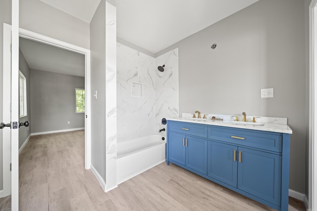 609 S St, Hot Springs, AR 71913 - full bath with vanity, washtub / shower combination, and wood finished floors