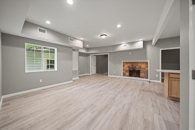 609 S St, Hot Springs, AR 71913 - unfurnished living room featuring recessed lighting, a stone fireplace, and visible vents