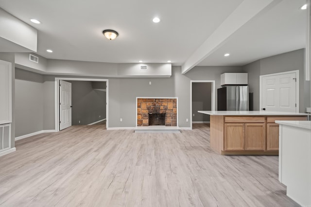 609 S St, Hot Springs, AR 71913 - kitchen featuring a fireplace, light countertops, freestanding refrigerator, recessed lighting, and visible vents