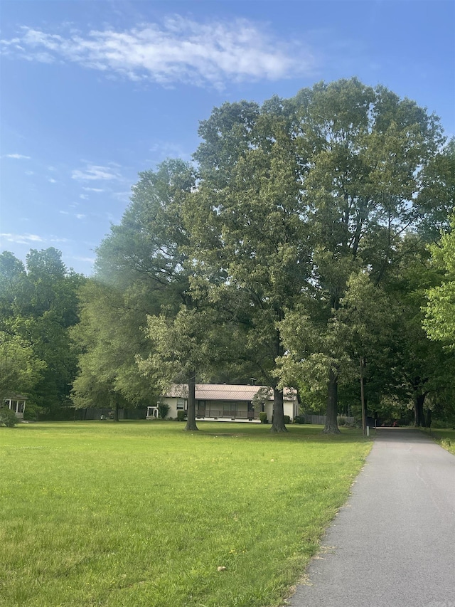 surrounding community featuring a lawn