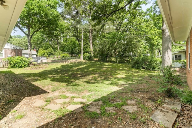 view of yard featuring fence