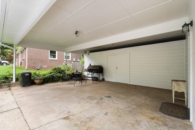view of patio / terrace with an attached carport and area for grilling