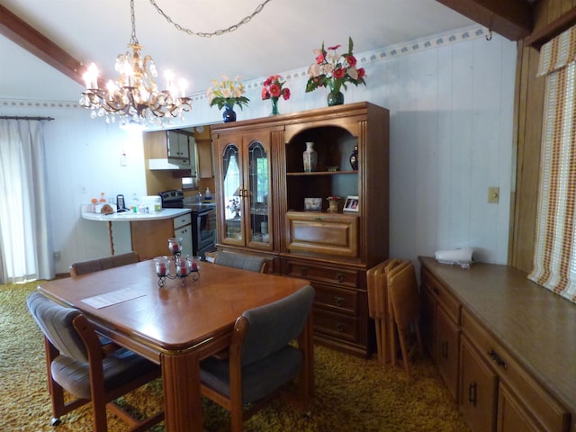 carpeted dining area featuring a notable chandelier