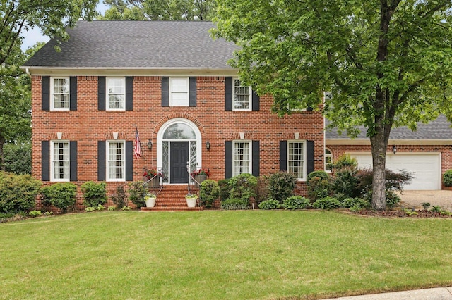 4109 Valley View Dr, Little Rock, AR 72212 - colonial home featuring brick siding, a garage, a shingled roof, and a front lawn
