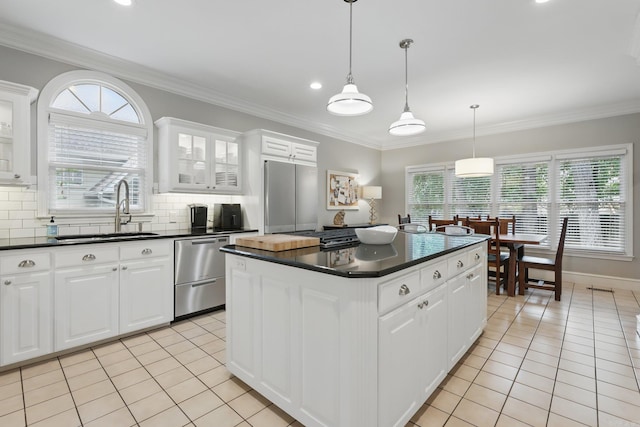 4109 Valley View Dr, Little Rock, AR 72212 - kitchen with light tile patterned floors, dark countertops, appliances with stainless steel finishes, and a sink
