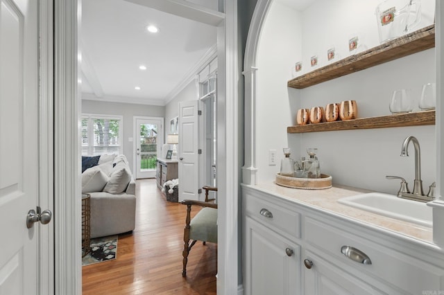 4109 Valley View Dr, Little Rock, AR 72212 - bar with crown molding, light wood-style flooring, recessed lighting, and a sink
