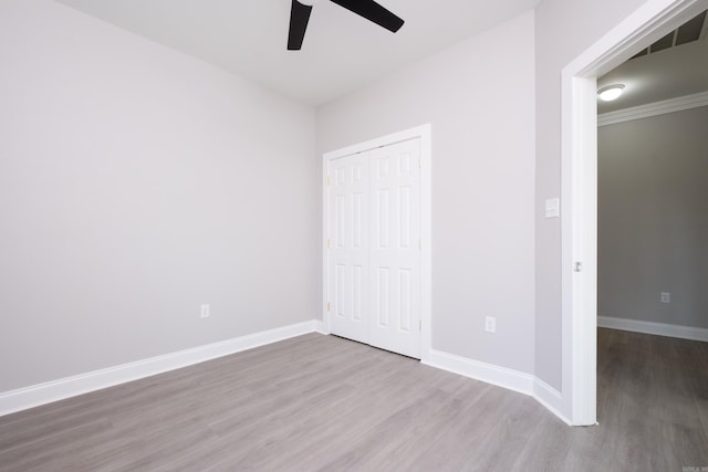 2919 Martel Ave, Little Rock, AR 72206 - unfurnished bedroom with a closet, baseboards, ceiling fan, and wood finished floors