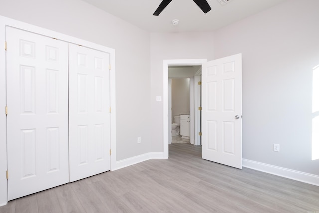 2919 Martel Ave, Little Rock, AR 72206 - unfurnished bedroom featuring light wood-type flooring, a ceiling fan, baseboards, and a closet