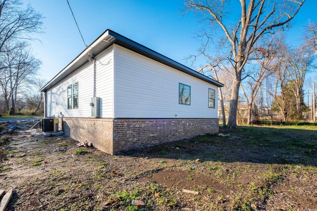 2919 Martel Ave, Little Rock, AR 72206 - view of side of home with brick siding and central AC