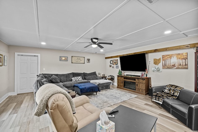 living room with recessed lighting, a ceiling fan, baseboards, and light wood-type flooring