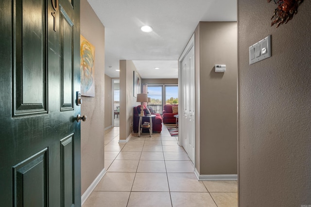 101 Long Island Dr, Hot Springs, AR 71913 - corridor with baseboards, a textured wall, and light tile patterned flooring