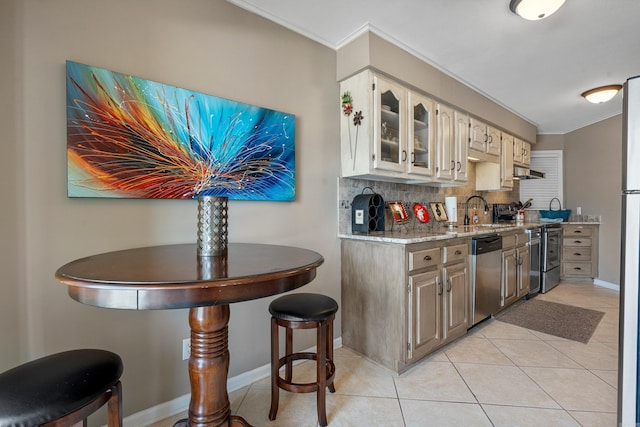101 Long Island Dr, Hot Springs, AR 71913 - kitchen featuring crown molding, a sink, stainless steel appliances, light tile patterned floors, and backsplash