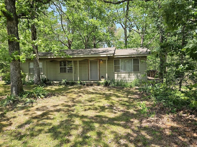 ranch-style house featuring a porch and a front yard